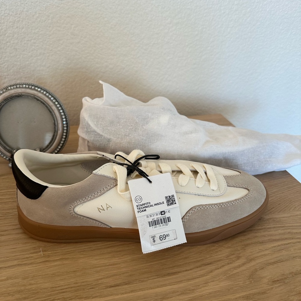 Zara sneakers, with NA initials. Never been worn. Purchased wrong size.